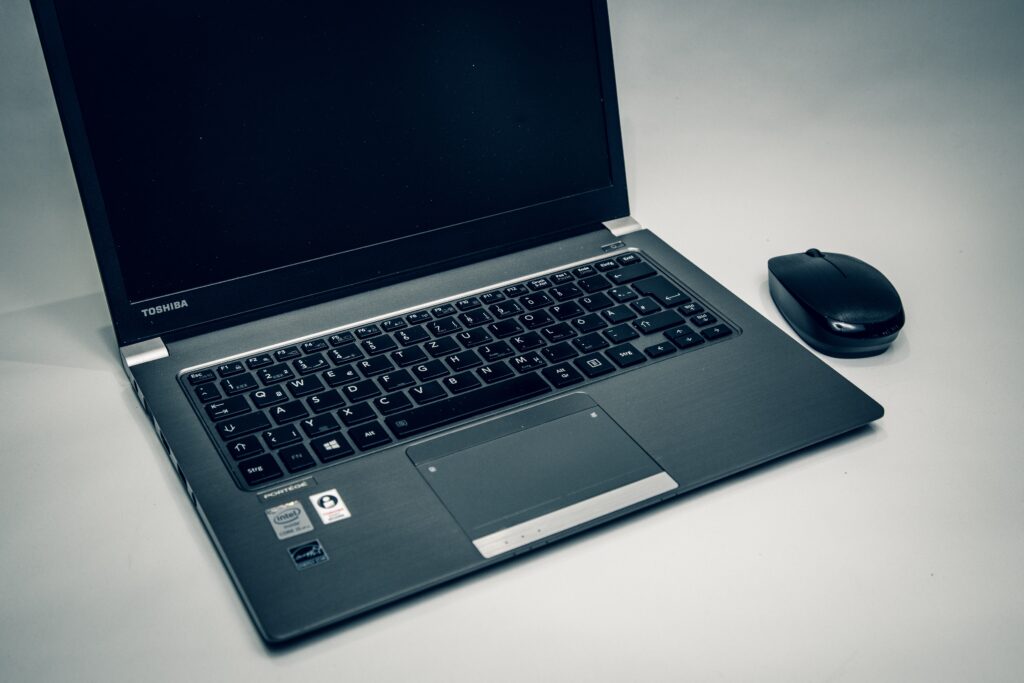 laptop and mouse on a table